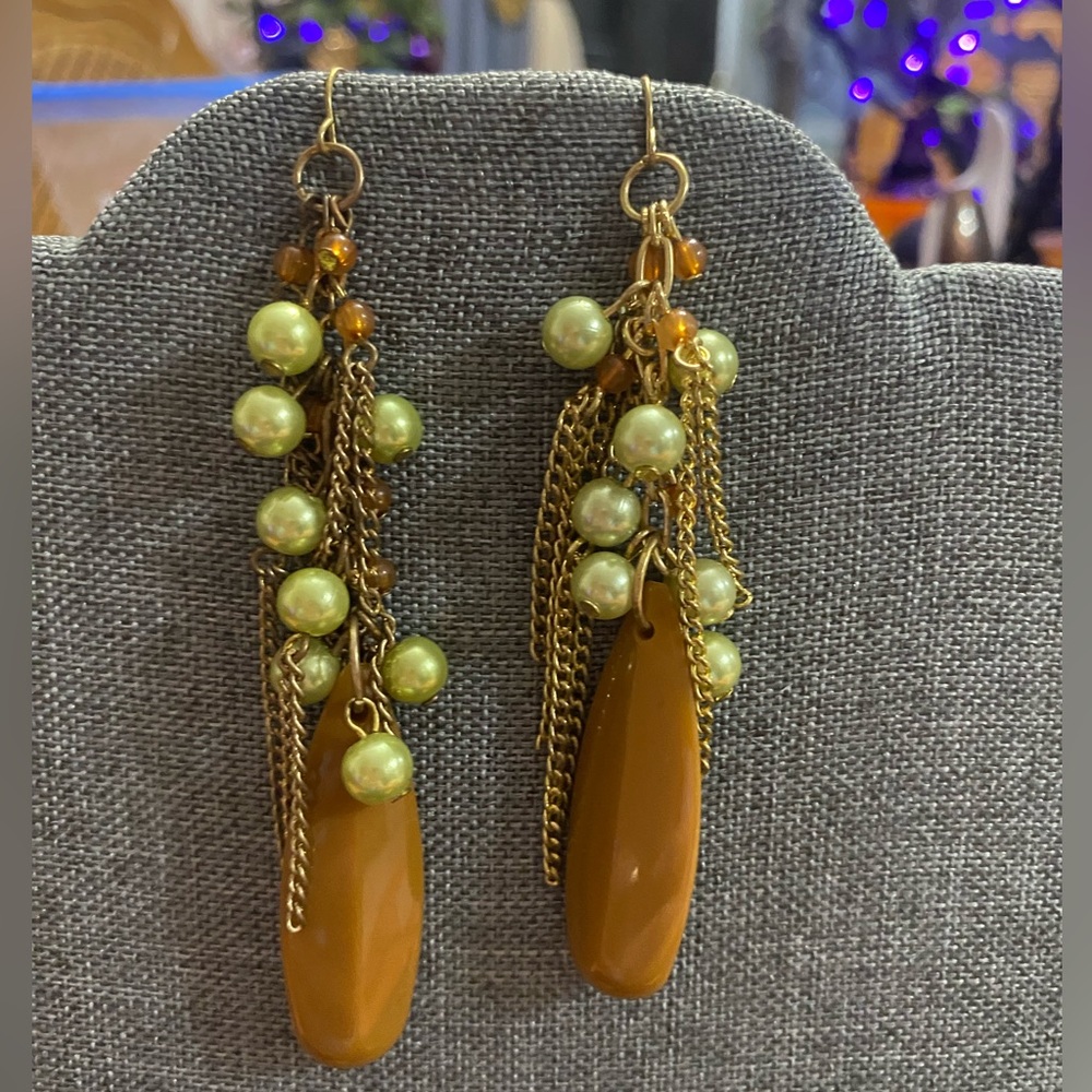 Brown/green pearl beads with gold chains dangle pierced earrings.  Apps 4” long.